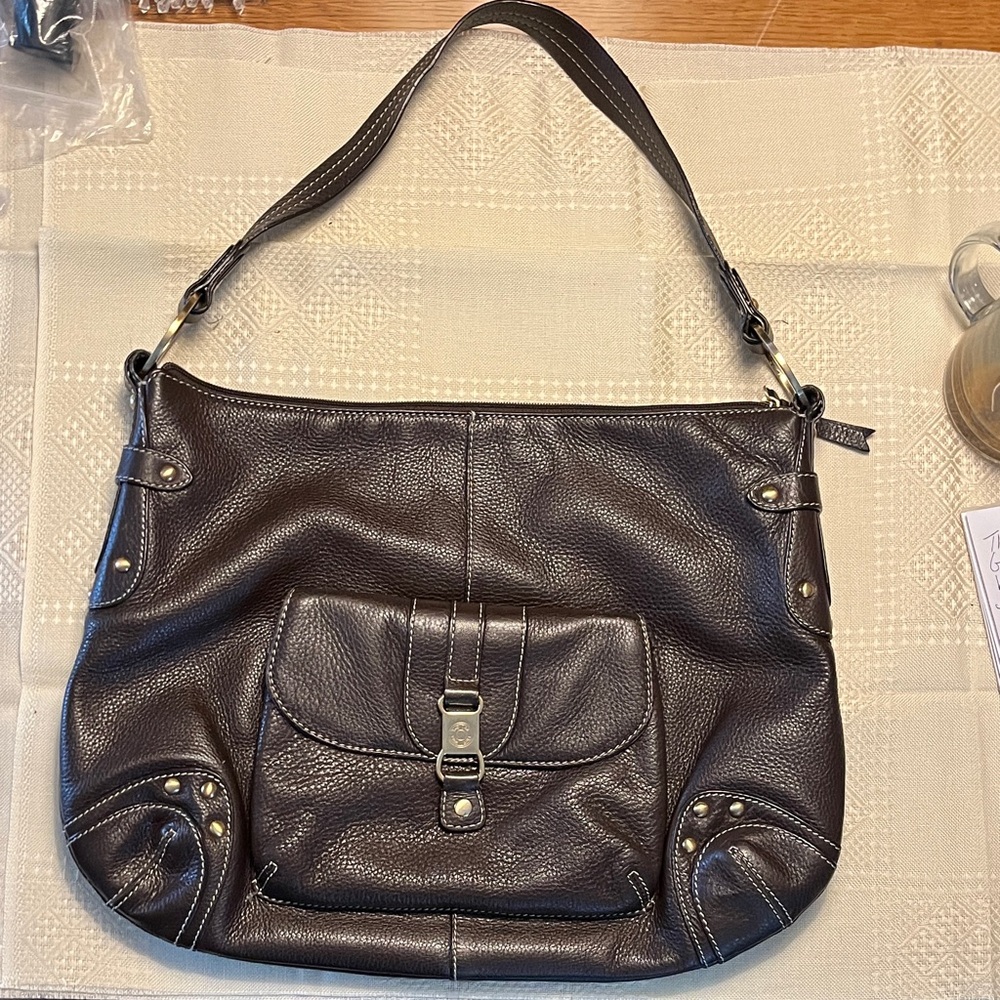 The Sak pink label, genuine leather bag.